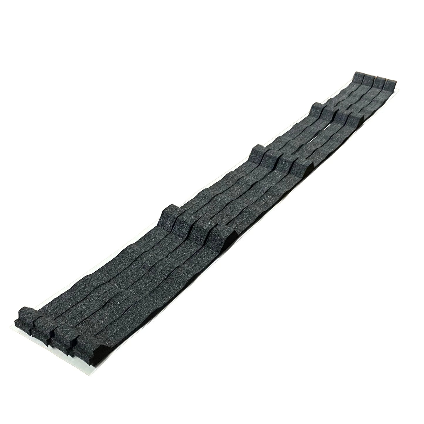 A set of dark gray foam closure strips designed for 'Pro' rib metal roofing panels. The image shows the strips featuring a contoured, wavy profile that matches the rib pattern of the roofing, used to provide a weather-tight seal at the eave or ridge.